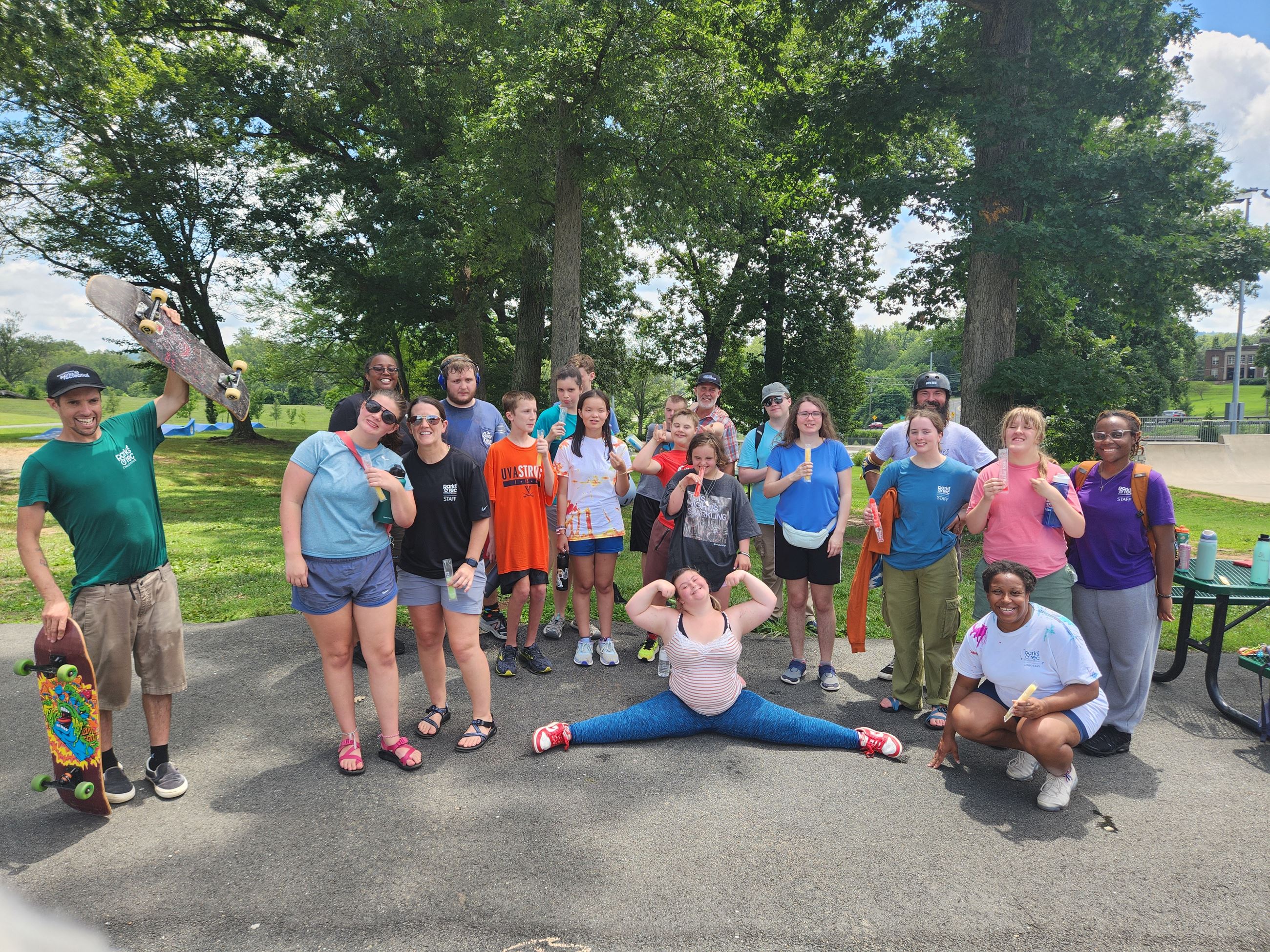 Adaptive participants posing for picture after skateboarding program 