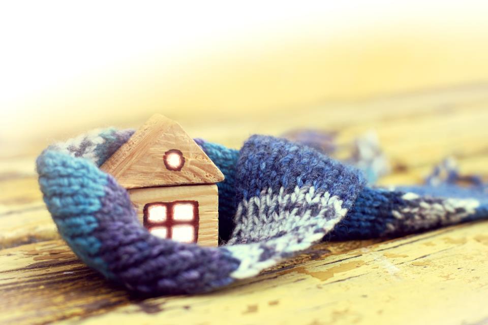 Small wooden house on mitten